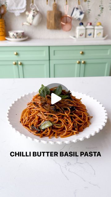 Ayushi Gupta-Mehra on Instagram: "CHILLI BUTTER BASIL PASTA 🌿 🍝 | Full recipe pinned to the comments. 

You only need ten minutes to make this simply yet incredibly-flavourful fusion dish - it’s so rich in umami with fresh basil adding a fragrant hit to our action-packed sauce. 

As always, feel free to adjust all the ingredients/ measurement according to taste & don’t forget to tag me when you DIVE IN!

{easy recipes, fusion recipes, chilli oil , pasta recipes, noodle recipes, Asian recipes #veganrecipes #quickrecipes #pastarecipe #pastalovers #asianfood #umami #chilli #spicyfood}" Oil Pasta Recipes, Noodle Recipes Asian, Snacky Lunches, Ayushi Gupta, Oil Pasta, Fusion Recipes, Recipes Asian, Chilli Oil, Fusion Dishes