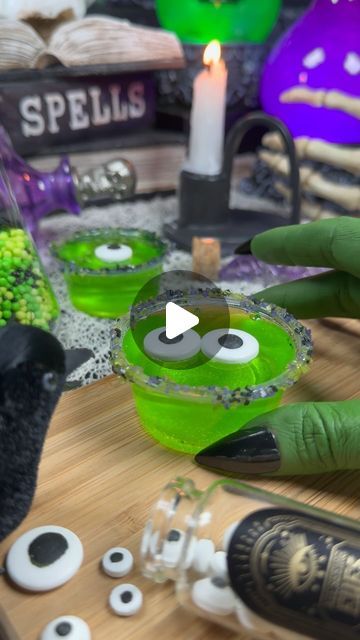 Jamie Kirchner | Holiday Inspo on Instagram: "Eye of Newt Jelly Shots

This jelly shot kit from @fancyspinkles is available at Walmart, and a Halloween party in a box! Everything you need is included - lime gelatin, plastic cups, edible glitter, sugar sprinkles, and candy eyeballs. Substitute water for tonic water for a fun glittery glowing effect! 

#halloweenparty #spookyseason #fancysprinkles #halloweendrinks" Edible Glitter Sugar, Hello Shots, Eye Of Newt, Edible Eyes, Jello Cups, Jelly Shots, Fancy Sprinkles, Candy Eyeballs, Holiday Inspo