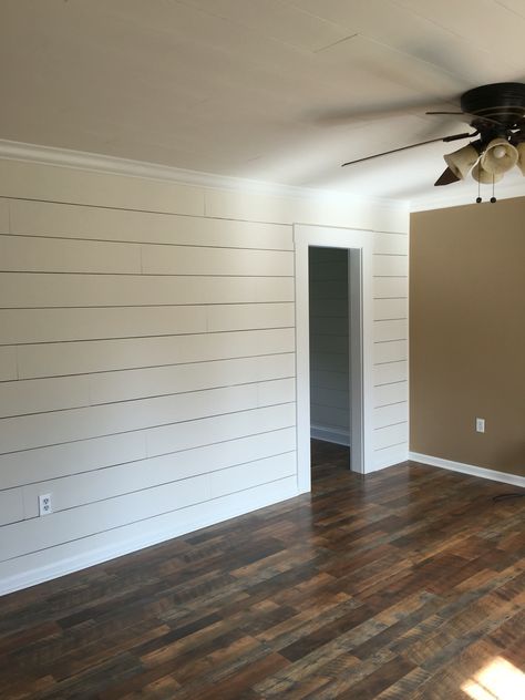 Client remodel. Faux shiplap wall with larger 1/8" spacing and Pergo Max flooring in River Road Oak Faux Shiplap Wall, Wainscoting Bedroom, Shiplap Wall Diy, Shiplap Wall, Diy Shiplap, Faux Shiplap, Plank Walls, River Road, Wallpaper Accent Wall