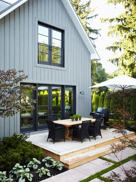 Blue-gray board and batten, black door/window frames, and white soffits, via House and Home. Board And Batten Exterior, Farmhouse Exterior Design, Gray House, Board And Batten Siding, Pintura Exterior, Grey Houses, Grey Exterior, Casa Exterior, Modern Farmhouse Exterior