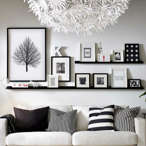 Wall Decor Black Picture Shelf, Black Picture Shelves, Long Picture Ledge Above Couch, Front Room Wall Decor Ideas, Photo Shelves Display, Picture Shelf Living Room, Over The Couch Wall Decor, Wall Art Shelf, Long Shelves