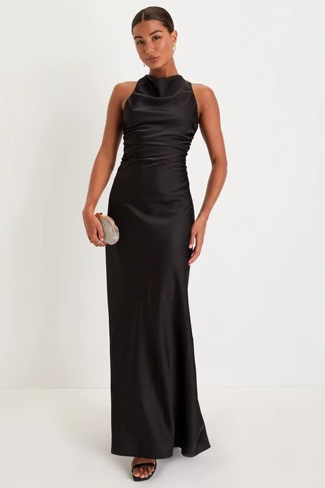 Everyone will be talking about how dreamy you look in the Lulus Effortlessly Sensational Black Satin Backless Maxi Dress! Sleek woven satin shapes this stunning dress with a high cowl neckline that continues into a draping, fitted bodice with gathering at the sides, all supported by wide straps that crisscross the otherwise open back. The figure-skimming slip silhouette falls effortlessly into an A-line skirt that ends at a sweeping maxi hem. Hidden back zipper/clasp. Black Maxi Wedding Guest Dress, Black Satin Backless Dress, High Neck Black Bridesmaid Dresses, Long Elegant Satin Dresses, Fall Black Bridesmaid Dresses, Black Bridemaid Dress, Black Maid Of Honor Dress Long, Maid Of Honor Black Dress, Azazie Black Bridesmaid Dresses