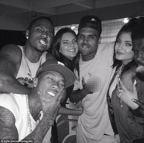 Charmer: The 25-year-old flashed a middle finger as the 18-year-old cuddled up with him Kylie Jenner Instagram Pictures, Chris Brown Party, Kylie Jenner Party, 2016 Rap, Instagram Kylie Jenner, Robert Kardashian Jr, Kylie Jenner Instagram, 2013 Swag Era, Bruce Jenner