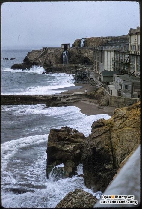 Here is an old, historic photo of the ocean side of the Sutro Baths. Note the retaining wall that ran from the baths out to an offshore island. This was an attempt to stop heavy surf from bashing into the building and filling the pools with sand. This happened many times in the long history of Sutro's. This photo is dated 1958. c. openhistory. From Doug Floyd, vF 4-23-22 Cliff House San Francisco, Sutro Baths San Francisco, Tram Station, Sutro Baths, Cliff House, California History, Golden Gate Park, Abandoned Houses, Retaining Wall