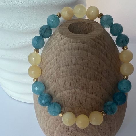 Soft Yellow Honey Calcite And Blue Agate Stretch Beaded Bracelet Blue Agate Crystal Offers Its Bearers 'Emotional Facelifts' The Stone Is Used As A Means Of Healing And Building Strong Emotional Health In Order To Keep Physical Health In Check This Crystal Is Linked To The Heart Chakra Size Approximately 6.75” 8mm Round Gemstone Beads Gold Toned Accent Beads Easy Slip On Design Strong And Durable Stretchy Cord Feminine And Preppy Honey Calcite Is A Spiritual Crystal Linked To The Higher Consciou Blue Agate Crystal, Snowflake Jewelry, Beautiful Beaded Bracelet, Healing Gemstone Bracelets, Boho Wrap Bracelet, Honey Calcite, Beads Pictures, Handcrafted Bracelets, Bracelet Blue