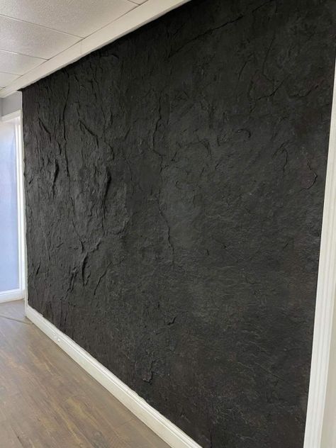 Rock Wall Shower Ideas, Faux Rock Wall Interior Living Room, Modern Industrial Accent Wall, Concrete Wall Design Interior, Black Stucco Wall, Textured Walls Black, Concrete Accent Wall Living Rooms, Textured Walls In Bathroom, Accent Walls Basement