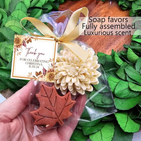 Fall soap favors Give your event a personal touch with our personalized favors! Your guests will love these adorable soap favors! --- Hand poured shea butter soaps scented with essential oils --- Each favor is individually wrapped and includes a personalized tag, satin bow --- Satin bow color will match soap color choice -- Each bag contains two soaps- one leaf and one flower. Leaf soaps will be a variety of leaf shapes.  --- Available in six scents: please refer to listing photos for scent desc Fall In Love Bridal Shower Favors, Fall Bridal Shower Party Favors, Fall Party Favors For Women, Bridal Shower Guest Gift Ideas, Fall Bridal Shower Favors, Fall Party Favors, Fall Wedding Favors, Unique Bridal Shower Favors, Fall In Love Bridal Shower