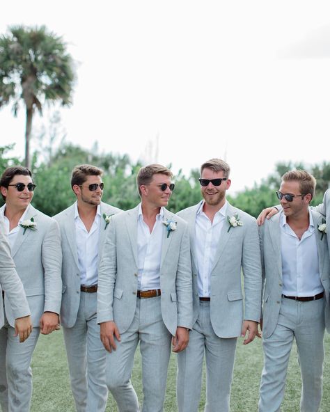 The perfect suit for a sunny destination wedding 😎 📸 @floridaweddingdesign #destinationwedding #weddingsuits #suit #groomsuit #weddingplanning #weddinginspiration #groomtobe #summerwedding #springwedding Beach Wedding Groom Attire Grey, Wedding Male Suit, Grey Suit Beach Wedding, Grooms Suit Colors, Pale Blue Groomsmen Suits, Men’s Wedding Suit Colors, Men’s Suits Wedding Summer, Coastal Groomsmen Attire, Beachy Groomsmen Attire