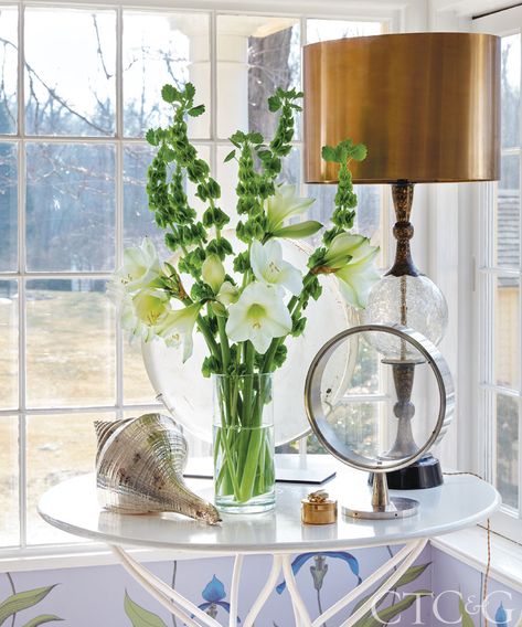 Step Inside Home Accessories Designer Joanna Buchanan’s Bright and Modern Home - Cottages & Gardens Good Earth India, Hamptons New York, Joanna Buchanan, Cane Back Chairs, Brass Light Fixture, Ottoman Cover, Dream Cottage, Little Cottage, Brass Lighting