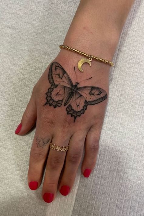 Top 23 Butterfly Hand Tattoo Ideas to Embrace Elegance Big Butterfly Hand Tattoo, Spooky Butterfly Tattoo, Bord Tattoo, Butterfly On Hand Tattoo, Butterfly Hand Tattoo For Women, Hand Tattoo Butterfly, Butterfly Hand Tattoos, Hand Butterfly Tattoo, Hand Tattoo Women