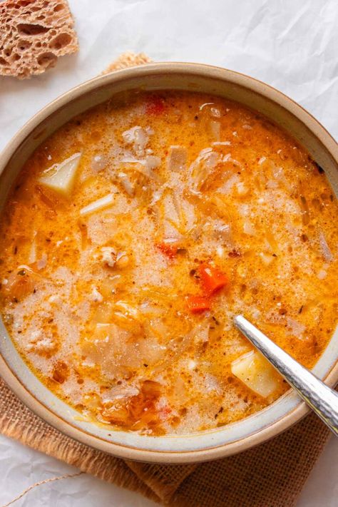 If you’re looking for a soup this fall or winter that’s comforting, filling, and slightly tangy, then give this Polish sauerkraut soup a try. Traditionally known as Kapusniak, it’s a tasty combination of tender pork ribs simmered in a rich broth, combined with the tangy sauerkraut and hearty potatoes. Serbian Soup Recipes, Vomacka Soup Recipe, Kapusniak Soup, Polish Sauerkraut, Tender Pork Ribs, Creamy Chicken Dinner, Yummy Nummies, Lost Recipes, Sauerkraut Soup