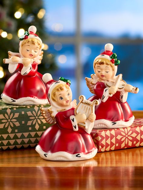 Our exclusive Christmas figurine angels are based on a vintage design and will serenade you from on high - each one playing a separate instrument: flute, harp, and violin. Each charming ceramic figurine has a soft matte finish and hand-painted details, making this trio the perfect addition to your collection or gift to give. Either way, these angelic cherubs will be treasured for generations to come. Ceramic with matte finish Hand-painted details Nostalgic vintage design Approx. 4" tall Set of t Repainted Ceramic Figurines, Vintage Christmas Table Settings, Christmas Hope, Pond House, Christmas Angel Figurine, Ceramic Home Decor, Holiday Traditions Family, Pretty Christmas Decorations, Ceramic Home