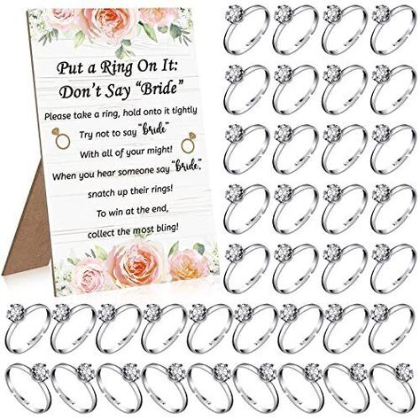 Kathfly Put a Ring on It Bridal Shower Games with 100 Bridal Shower Rings Wedding Shower Games Engagement Party Games Not Say Bride Rules Cards Bridal Shower Decorations for Guest Bridal Shower Favors Funny Bridal Shower Games: you will be provided with 100 pieces of bridal shower rings for games and 1 piece of do not say bride game rules card, sufficient quantities can entertain your families and guests in bridal shower Game's Rule: you can use the card with bridal shower rings together, each o French Themed Bridal Shower Games, Bridal Shower Advice For The Bride, Different Bridal Shower Games, Ring Game Bridal Shower Signs, Classy Bridal Shower Games, Simple Wedding Shower Ideas, Bridal Shower Prizes For Games, Bridal Shower Games Funny Interactive, Bridal Shower Ideas Games