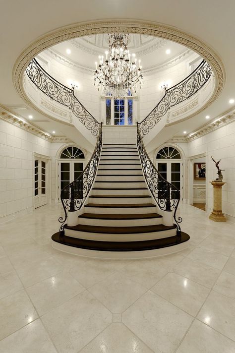 This $12.5 million McLean mansion has a ballroom and an indoor basketball court | Luxury Homes | Washingtonian سلالم حلزونية, Luxury Staircase, Indoor Basketball Court, Marble Flooring, Foyer Decorating, Luxury Chandelier, Luxury Homes Dream Houses, Grand Staircase, House Goals