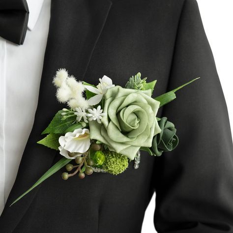 PRICES MAY VARY. Design Inspiration: Immerse yourself in a green wonderland with Ling’s Emerald and Tawny Beige collection. Size: The pocket square boutonniere is approx. 6" W x 5" H. Combination of flower and card, the groom can easily put the boutonniere into suit jacket pockets. Material: The boutonnieres are made of real-looking artificial flowers and greenery, dotted with some exquisite accessories. Great Design: A Deluxe boutonnieres designed for the groom. The unique design is convenient Artificial Flowers For Wedding, Green Boutonniere, Pocket Boutonniere, Green Pocket Square, Boutonnieres Prom, White Boutonniere, Wedding Color Pallet, Groomsmen Boutonniere, Rose Boutonniere