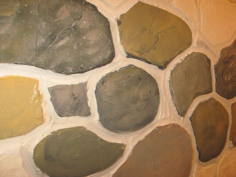 DIY Fake Stone Wall—Cheap and Fun! | Dengarden How To Create A Faux Stone Wall, Faux Stone Painting Technique, Faux Stone Wall Interior, Fake Stone Wall, Stone Doorway, Faux Stone Walls, Diy Fireplace Makeover, Faux Rust, Exterior House Remodel