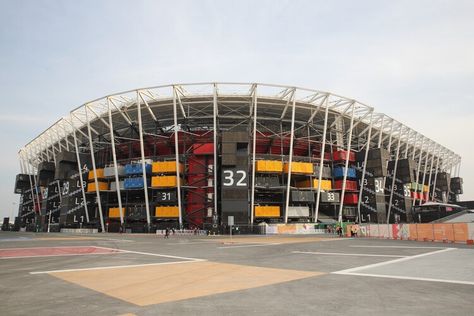 Workers Begin Dismantling Qatar’s Stadium 974, the First Temporary World Cup Stadium | ArchDaily World Cup Stadium, Hamad International Airport, World Cup Stadiums, Education City, Football Pitch, Sports Arena, Construction Worker, Developing Country, Fifa World Cup