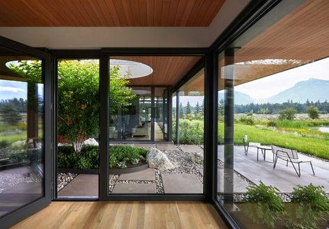 CLB Architects arranges Wyoming home around courtyard gardens Clb Architects, Western Red Cedar Cladding, Fireplace Facing, Courtyard Gardens, Cedar Cladding, Japanese Zen Garden, Double Sided Fireplace, Internal Courtyard, Clerestory Windows