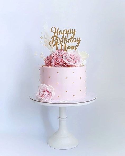 A birthday cake is a special cake that is made to celebrate someone's birthday. Birthday cakes are typically decorated with candles, frosting, and other toppings, and they can be made in a variety of shapes and sizes. Here is a description of a classic birthday cake: A two-layer round cake with white buttercream frosting and rainbow sprinkles. Small Pink And Gold Cake, Cake Design For Grandma Birthday, Mom Birthday Cake Ideas Simple, Simple Birthday Cake Designs For Women, Small Birthday Cake For Women, 40th Birthday Cake Ideas For Women, 80th Birthday Cakes For Women, 80th Birthday Cake For Grandma, Classic Birthday Cake