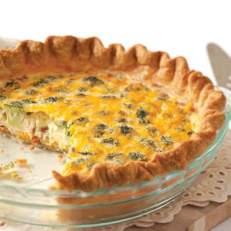 Broccoli and Cheddar are flavors that pair well together in soups, salads, and even breakfast dishes. This quiche recipe showcases the best of the vegetable and the cheese to serve at your next brunch. Broccoli Cheese Quiche, Broccoli Cheddar Quiche, Cheddar Quiche, Broccoli And Cheddar, Broccoli Quiche, Paula Deen Recipes, Cheese Quiche, Breakfast Quiche, Broccoli Cheddar