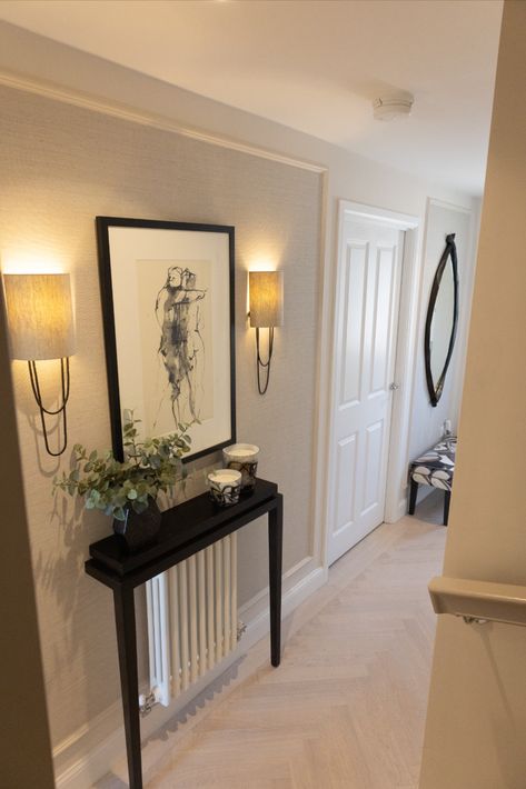 Bespoke Design can be cleverly worked into any space. Our work on this residential project demonstrates this, adding a console table within this narrow hallway. Taking up no room at all through wall fitting the unit over this already existing radiator and decorating with candles and a plant. Elegant artwork is placed above between two matching lights.

The addition into this hallway completely transforms the space and proves how we can achieve interior transformations in any home. Console Table Hallway Radiator, Long Narrow Hallway Decorating, Cornwall Life, Small Hallway Decorating, Decorating With Candles, Hallway Upstairs, Downstairs Hallway, Decorating Hallways, Wall Radiators