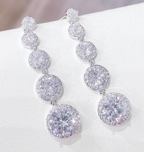 Description & Details Add Hollywood glamour to your outfit with our Zara earrings. Dazzling white crystal gemstones surrounded by a halo of small sparkly diamonds, these stunning long drop earrings make a beautiful gift or a treat for yourself. Large size. Drop Earrings. 925 Sterling silver posts. Cubic Zirconia stones. Measuring 4.8cm x 1.1cm. All of our Jewellery comes in a complimentary Suedette Pouch. Follow us on Instagram & Facebook @valentinarosejewels to be the first to hear abou earring Skull Jewelry Women, White Stone Earrings, Zara Earrings, Buy Earrings Online, Tiffany And Co Necklace, Earrings White Gold, Diamond Earrings Design, Drop Earrings Silver, Long Earring