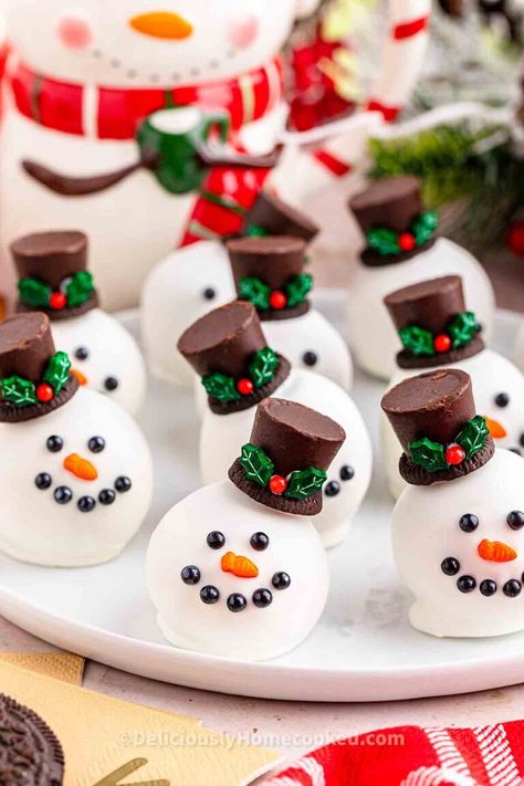 Snowman Oreo balls Oreo Snowman Cookie Balls, Christmas Themed Oreo Balls, Snowmen Oreo Balls, Oreo Ball Christmas, Oreo Cake Balls Christmas, Snowman Christmas Treats, Oreo Balls For Christmas, Oreo Ball Snowmen, Oreo Snowman Balls