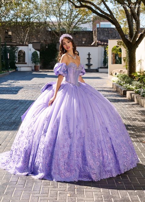 Be selfie ready in this beaded long strapless puff sleeve dress with A-line skirt by Rachel Allan RQ1142. Less is more in which this gown exudes a magical, fairy-tale charm with its delicate hue and intricate detailing. The gown features an off-the-shoulder neckline with romantic puff sleeves, and a bodice adorned with sparkling beads and sequins that cascade down the full, voluminous tulle skirt. Embellished with subtle floral embroidery, this gown is perfect for a quinceañera who dreams of a p Dama Dresses Quinceanera, 1500 Dresses, Quinceanera Tiaras, Dama Dresses, Military Ball Dresses, Champagne Dress, Dresses Quinceanera, Rachel Allan, Quinceanera Dress