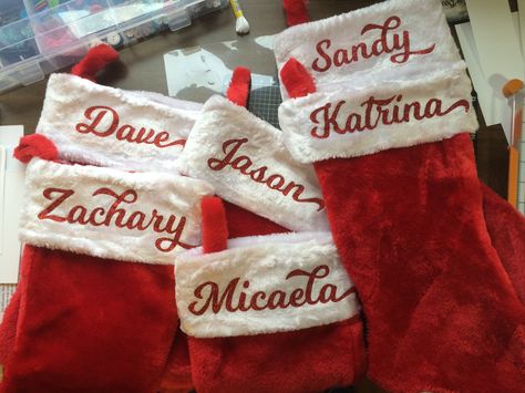 Christmas stockings. Red glitter HTV. Stockings Cricut, Cricut Christmas Stockings, Cricut Stockings Christmas, Stocking Names, Christmas Stockings Ideas, Cheer Crafts, Christmas Vinyl Projects, Cricut Projects Christmas, Htv Ideas