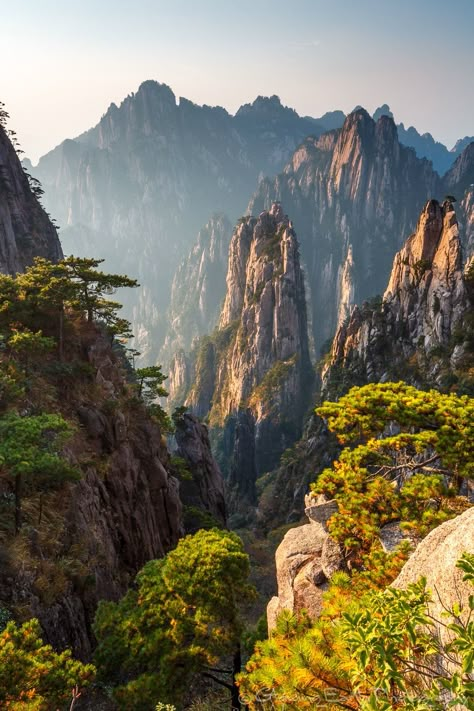 Huangshan, China - View of the West Sea Canyon from atop Huangshan (Yellow Mountain) in Anhui province, China. Huangshan is world-famous for its extreme granite peaks, which have inspired Chinese artists for centuries. China Vacation, Chinese Mountains, Earth Photography, China Travel Destinations, Huangshan, Travel China, Chinese Landscape, Fantasy Places, China Travel