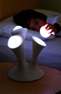 You can take the glowing orbs with you when getting up to go to the bathroom. | 41 Coolest Night Lights To Buy Or DIY Toddler Alarm Clock, Glow Lamp, Modern Lighting Design, Cool Lamps, Kids Night, Night Light Kids, Unique Kids, House Doctor, Night Lamps