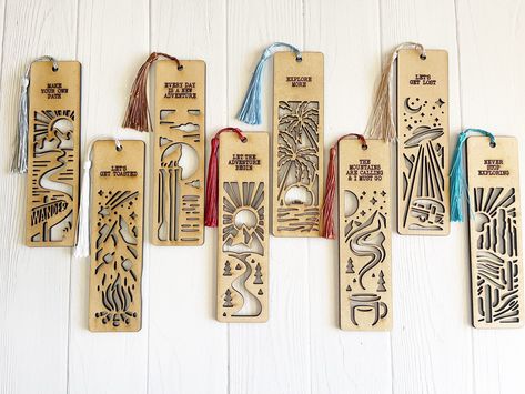 Introducing our delightful Set of 8 Wooden Adventure Bookmarks with Tassels and Inspiring Nature Quotes! Each of these bookmarks features an enchanting outdoor nature scene, ready to whisk you away to endless literary adventures. Crafted with care, these sturdy wooden bookmarks are cut out in intricate designs, creating a visual treat for your reading pleasure.  Measuring 6.75 x 1.75 inches, they fit perfectly inside any book, keeping your place with style. The set includes all eight bookmarks, Glowforge Bookmark, Laser Bookmark, Book Keeping, Wooden Bookmarks, Wood Bookmark, Anime Crafts Diy, Inspiring Nature, Diy Laser Cut, Diy Bowl