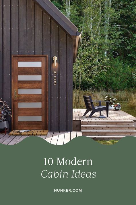 For some, the word "cabin" evokes images of off-the-grid, modest structures located deep in the woods, void of everyday conveniences including running water and electricity. If that's not your idea of a good time, behold modern cabin ideas. #hunkerhome #modern #cabinideas #moderncabin #moderncabinideas Modern Cabin Backyard, Modern Camp House, Small Black Cabin, Modern Outhouse Ideas, Organic Modern Cabin, Small Black House Exterior, Modern Cabin Exterior Design, Modern Cabin Exterior Colors, Minimalist Cabin Interior