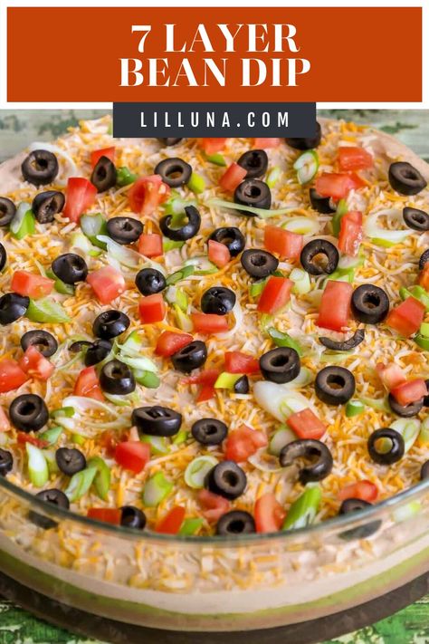 This 7 layer bean dip is a must-have at every function! It has loads of flavor and all your favorite dip ingredients! #7layerbeandip #7layerbeandiprecipe #beandip #7layerdip #tacodiprecipe Frito Lay Bean Dip, Layered Bean Dip Recipe, Cream Cheese Bean Dip, Layer Bean Dip, 7 Layer Bean Dip, Bean Dip Recipe, Layered Dip Recipes, Layered Bean Dip, 7 Layer Dip