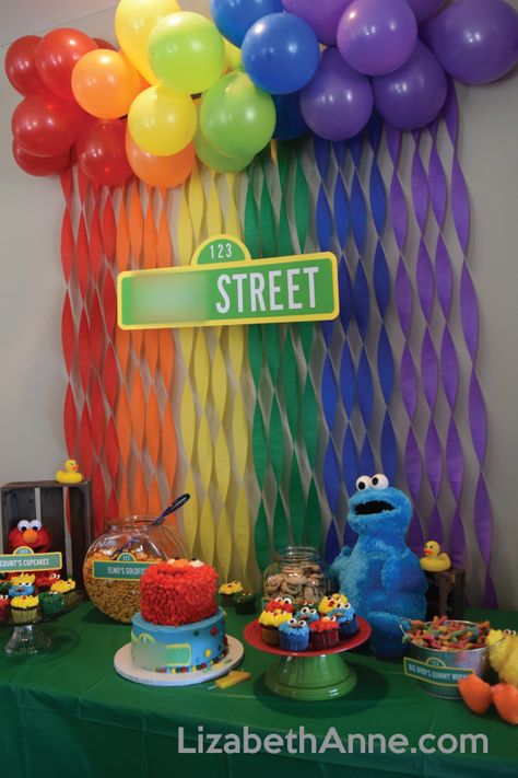 sesame street cake table with count's cupcakes, elmo's goldfish, cookie monster's cookies, and big bird's gummy worms. #sesamestreet #firstbirthday #elmo #birthdayparty Big Bird Theme Party, Diy Sesame Street Backdrop, Two Year Old Elmo Birthday Party, Elmo And Tango Birthday, Elmos Goldfish, Sesame Street Birthday Party Ideas 3rd, Sesame Street Decorations Birthday Ideas, Sesame Street Second Birthday Boy, Elmo And Friends Birthday Party