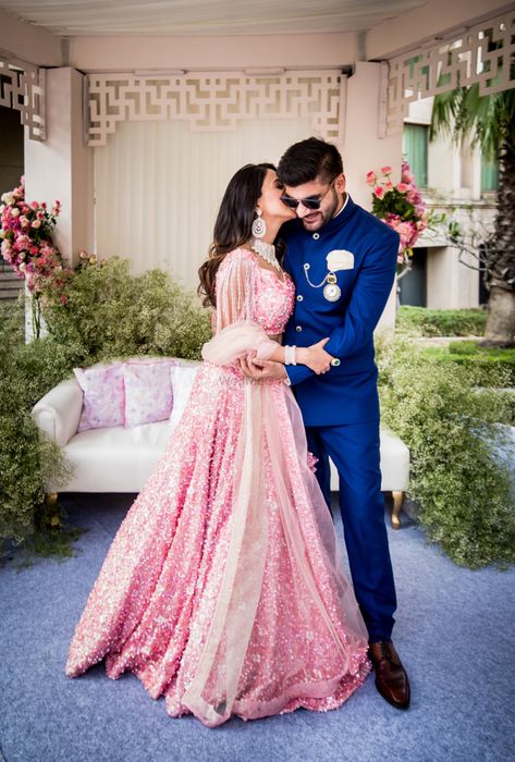 Beautiful couple portrait with pink lehenga |WedMeGood| Divya & Karan |#wedmegood #indianweddings #lehenga #bridallehenga #pink #portrait #coupleshot #coupleportrait Engagement Couple Dress, Engagement Dress For Groom, Engagement Dress For Bride, Engagement Lehenga, Indian Engagement, Indian Wedding Photography Couples, Couple Wedding Dress, Wedding Photoshoot Poses, Indian Wedding Photography Poses