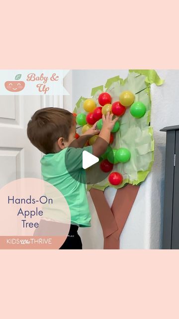 Megan | Kids Activities, Recipes, Hacks on Instagram: "🍎 🍏 You have to try this toddler favorite! 🍏 🍎   First, I made a big apple tree out of construction paper. (If you look closely, you can see I first tried to use contact paper, but it wasn’t sticky enough. More on that another day!) Then I covered the tree with green painters tape, sticky side out. I secured all the corners with more tape. The painters tape was the PERFECT amount of stickiness for the ball pit balls. My toddler had a blast “picking apples” then putting them back on. He did this all afternoon and evening! We then practiced some color recognition and counting.   If you’re going to try any toddler activity this week, this is the one!   #toddleractivities #toddlers #applepicking #fall #preschool #preschoolactivities #p Pin The Apple On The Tree Game, Apple Tree Craft For Toddlers, Contact Paper Toddler Activities, Apple Picking Activity For Toddlers, Tree Day Activities For Kids, Tree Out Of Construction Paper, Apple Day Activities For Kids, Apple Activities For Toddlers, Apple Tree Activity