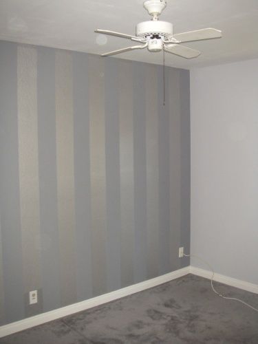 flex room: three walls (front door, opposite stairs and wall with inset) in a tonal vertical stripe. Grey Striped Walls, Striped Accent Wall, Wallpaper Minimal, Brown Living Room Decor, Wall Decorating, Striped Walls, Salon Suites, Light Grey Walls, Accent Walls In Living Room