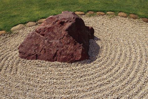 Tricks to Move Large Rocks by a Single Person | Hunker Landscape With Large Rocks, Big Rocks In Garden, Garden Large Rocks, What To Do With Big Rocks In Yard, How To Move Large Rocks, Driveway Border, Landscaping With Large Rocks, Bucket Filling, Building A Fence