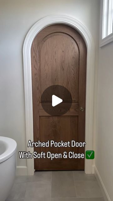 Scott & Britney Anderson • Affordable Home Inspiration on Instagram: "A soft open/close ARCHED door?!! 🤯 what more could you ask for?   Want to know @cardinalcrestkc ‘s secret?   Although the door panel has an arched detail, the door top itself is square. The trim around it is arched to make the door appear arched.   #pocketdoor #archdoor #archdoorway #homielovin  #homieinspo  #builderssecret  #bathroomdoor" Modern Arch Doors, Rounded Pocket Doors, Faux Arched Door, Interior Arched Doors, Arched Bathroom Door, Arched Pocket Doors Interior, Arch Pantry Door, Arch Doors Interior, Arched Doors Interior