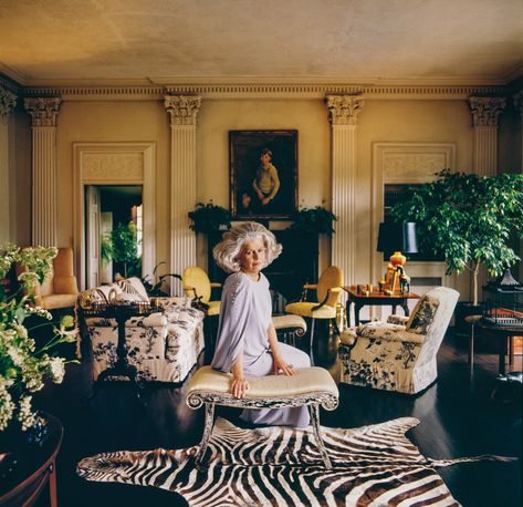 Nancy Pyne in her Albert Hadley-designed room at her New Jersey estate. The sofas are upholstered in custom-designed Schumacher chintz, which the designers reintroduced in 2010 and named Pyne-Hollyhock chintz in her honor. Pyne Hollyhock, Chintz Decor, Classic Office Interior, Chinoiserie Room, Albert Hadley, Zebra Rug, Glam Pad, Chintz Fabric, Maximalist Decor