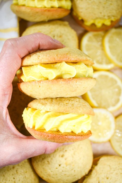 An easy recipe for lemon buttercream filled miniature whoopie pies. Made with fresh lemon juice and zest, plus a hint of pure lemon oil, these zesty lemon buttercream whoopie pies make a sweet summertime treat for picnics, bake sales, and birthday parties. The best easy lemon whoopie pie recipe! Lemon Cake Mix Whoopie Pies, Whoopi Pies Recipe, Cookie Filling Recipe, Key Lime Whoopie Pies, Lemon Whoopie Pie Recipe, Lemon Whoopie Pies, Vanilla Whoopie Pies, Strawberry Whoopie Pies, Cake Mix Whoopie Pies