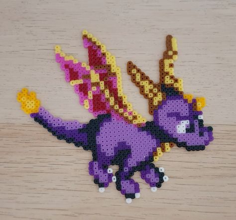 #spyro #dragon #yearofthedragon #playstation #plastationone #videogame #vintage #hama #beads #pixel #perler #beads #hamabeads #perlerbeads #pixelart Spyro Perler Beads, Graph Patterns, Kandi Kid, Perler Ideas, Beads Art, Spyro The Dragon, Perler Bead Art, Perler Bead Patterns, Perler Bead