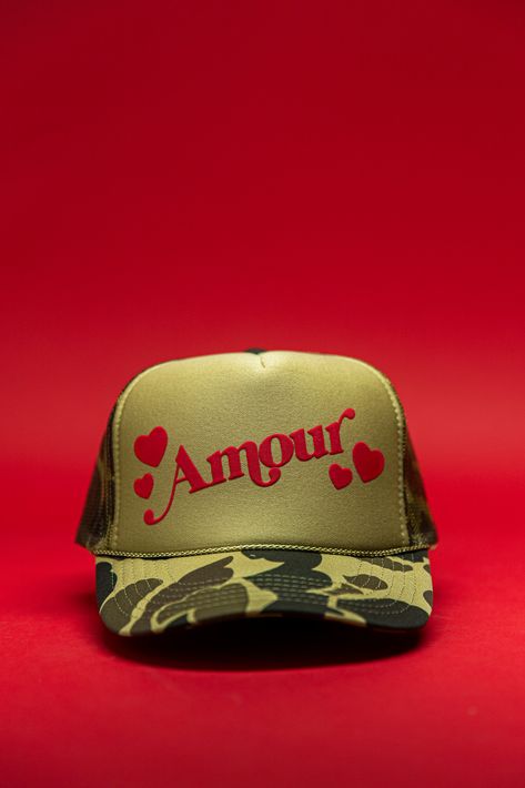 Love is in the air! Elevate your Valentine's Day with one of our favorite new truckers! This hat is made to order and will ship in 3-5 business days MADE TO ORDER PRODUCTS ARE FINAL SALE Valentine Hats, Camo And Red, Rose Hat, Apothecary Candles, Perfect White Tee, Car Fragrance, Dream Fashion, Vintage Patches, Small Boutique