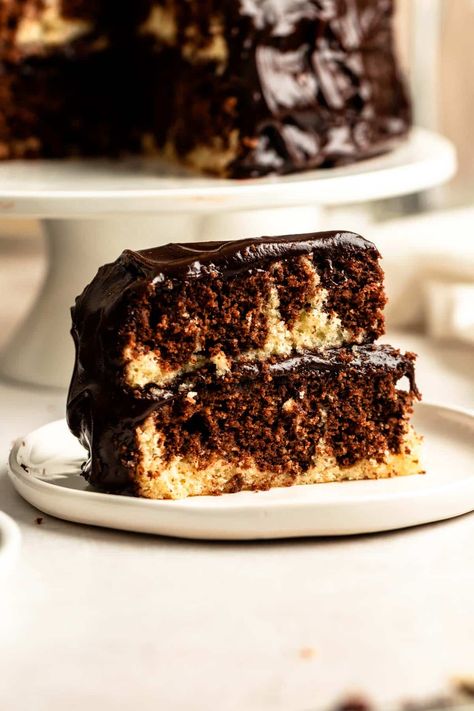 Slice of marble layer cake on a plate. Marble Layer Cake, Marble Layer Cake Recipe, Marble Frosting, Marble Birthday Cake, Marble Cake Using Box Cake, Chocolate Marble Pound Cake, Fudge Marble Cake, Cake On A Plate, Fudge Marble Bundt Cake