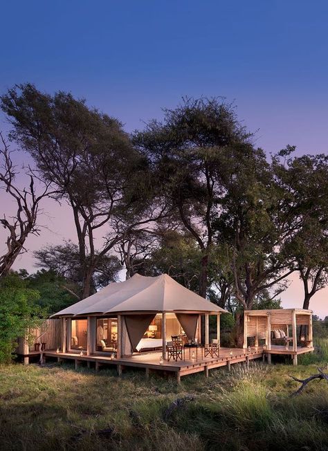 &Beyond Nxabega Okavango Tented Camp has nine luxurious suites, including a family unit comprised of two suites joined by a deck. Each room has both indoor and outdoor showers as well as an outdoor sala, perfect for cool afternoon naps or between-activity game viewing. Slightly elevated, overlooking a lagoon frequented by hippo and elephants, each room offers the utmost in vistas and privacy. Luxury at it's best. Timbuktu Travel. Tented Camp, Chobe National Park, Indoor Camping, Tent Living, Family Tent Camping, Okavango Delta, Safari Tent, Cool Tents, Luxury Safari