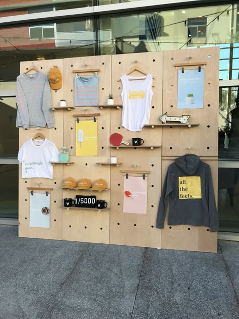 Pegboard Visual Merchandising, Peg Board Store Display, Pegboard Retail Display, Apparel Booth Display, Merch Booth Display Ideas, Merch Display Ideas, Diy Booth Display, Peg Board Display, Merch Display