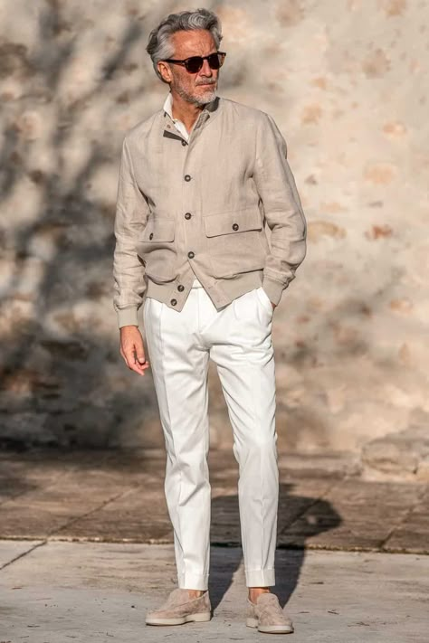 Men's white trousers, stone linen bomber jacket and suede loafers outfit. This image was included in the article: 6 Stylish Spring Jackets All Men Should Own For 2023, on MensFlair.com Stylish Men Winter Outfit, Linen Jackets For Men, Outfit Uomo Primavera, Massimo Dutti Outfit Men, Men’s White Outfit, Italian Mens Fashion Casual, Linen Trousers Outfit Men, Suede Loafers Men Outfit, Linen Men Outfit