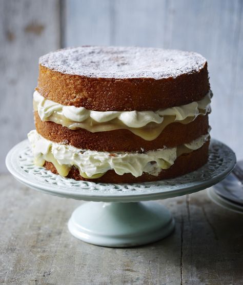 A stunning three-tiered cake filled with lemon curd and cream Lemon Cake With Lemon Curd, Cake With Lemon Curd, Mousse Au Chocolat Torte, Bake Off Recipes, Lemon Drizzle Cake, Drizzle Cake, Double Cream, Lemon Drizzle, Bbc Food