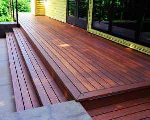 Stained Wood Deck - love this color for stain/deck, with whit white or cream railings Exterior Wood Siding Colors, Deck With Steps, Columns Ideas, Wood Deck Designs, Redwood Decking, House Porch, Patio Steps, Deck Steps, Patio Deck Designs